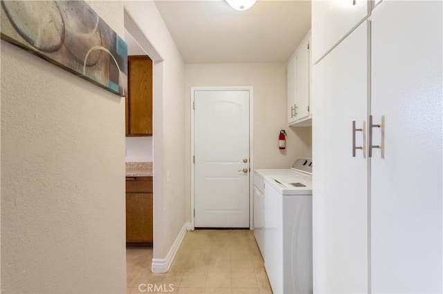 28001 Winged Foot Dr, Menifee, CA 92586 - laundry room featuring separate washer and dryer, cabinet space, baseboards, and light tile patterned floors