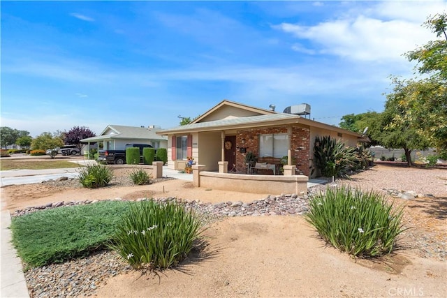 28001 Winged Foot Dr, Menifee, CA 92586 - view of front facade featuring brick siding and covered porch