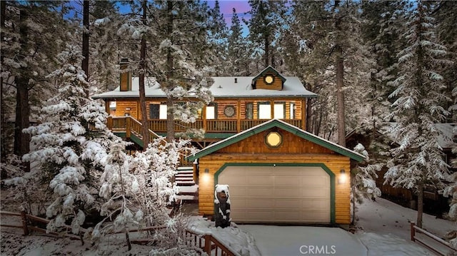 cabin with a garage and stairway
