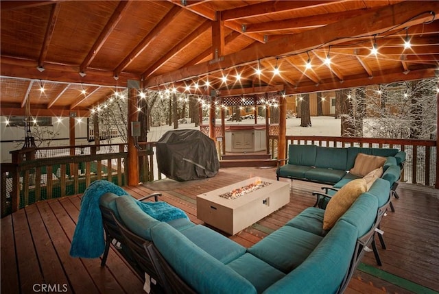 deck featuring an outdoor living space with a fire pit and grilling area
