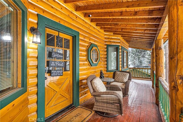 wooden terrace with covered porch