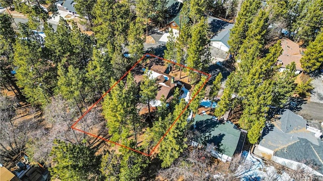 aerial view of property and surrounding area with property parcel outlined