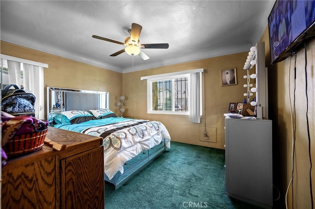 1022 W 101st St, Los Angeles, CA 90044 - bedroom featuring multiple windows, dark colored carpet, and ceiling fan