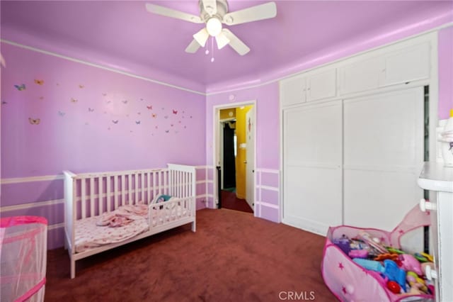 1022 W 101st St, Los Angeles, CA 90044 - carpeted bedroom with a crib, ceiling fan, and a closet