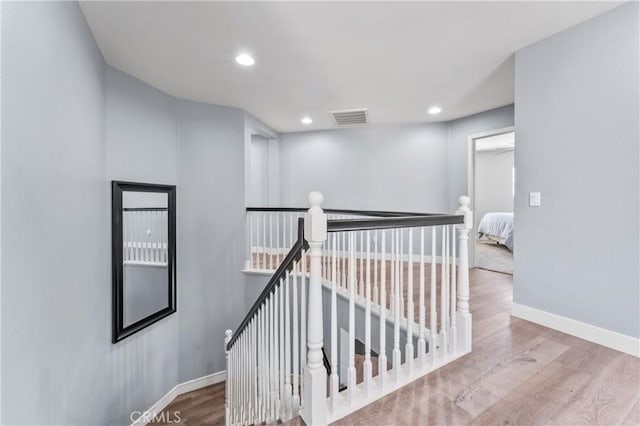 3039 Cayenne Way, Perris, CA 92571 - stairs with baseboards, wood finished floors, and recessed lighting