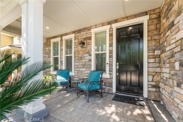 3039 Cayenne Way, Perris, CA 92571 - doorway to property featuring stone siding and covered porch