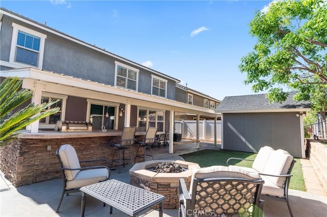 3039 Cayenne Way, Perris, CA 92571 - view of patio featuring a fire pit and an outdoor structure