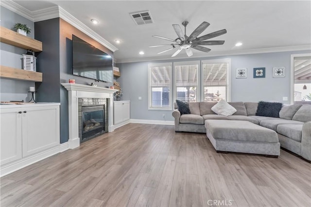 3039 Cayenne Way, Perris, CA 92571 - living area featuring a ceiling fan, recessed lighting, a tiled fireplace, wood finished floors, and crown molding