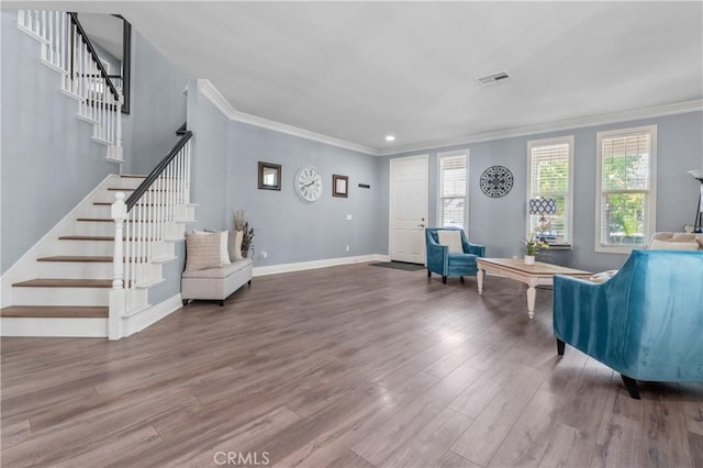 3039 Cayenne Way, Perris, CA 92571 - living area featuring ornamental molding, wood finished floors, stairs, baseboards, and recessed lighting