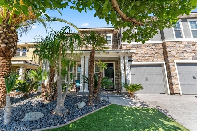 3039 Cayenne Way, Perris, CA 92571 - view of front of house with an attached garage, driveway, and stone siding