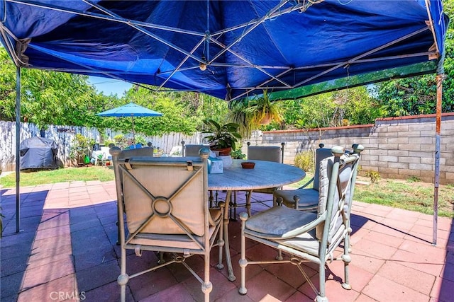 8748 Sylmar Ave, Panorama City, CA 91402 - view of patio with a fenced backyard and outdoor dining area
