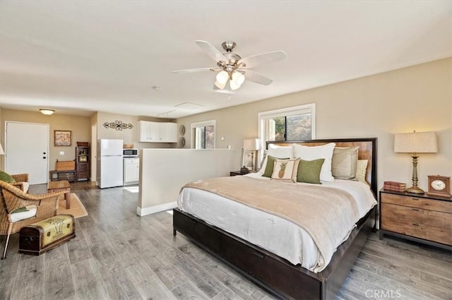 26780 Camino Seco, Temecula, CA 92590 - bedroom with freestanding refrigerator, wood finished floors, a ceiling fan, and baseboards