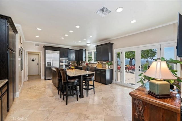 26780 Camino Seco, Temecula, CA 92590 - dining space with crown molding, recessed lighting, light tile patterned floors, and french doors