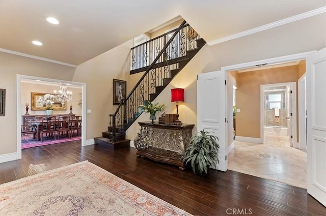 26780 Camino Seco, Temecula, CA 92590 - foyer entrance with baseboards, stairway, ornamental molding, a chandelier, and wood-type flooring