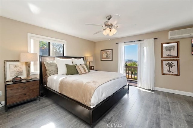 26780 Camino Seco, Temecula, CA 92590 - bedroom featuring a wall mounted AC, access to outside, multiple windows, and wood finished floors