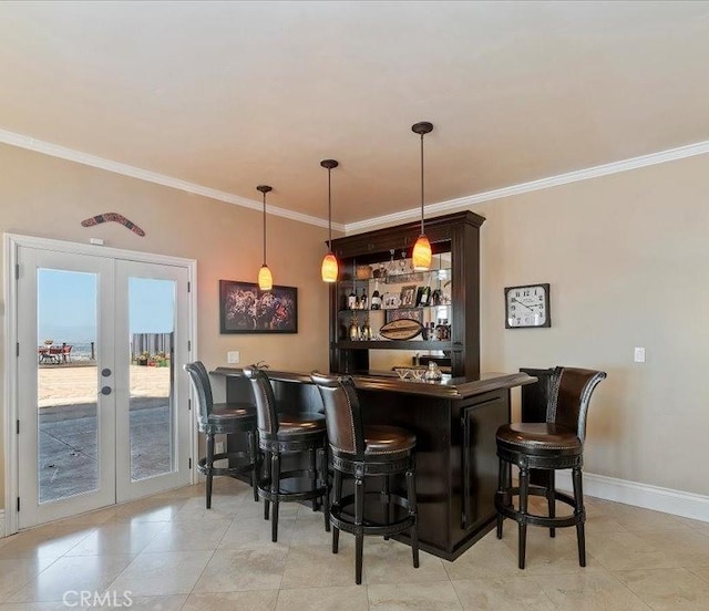 26780 Camino Seco, Temecula, CA 92590 - indoor dry bar featuring french doors, ornamental molding, light tile patterned flooring, and pendant lighting