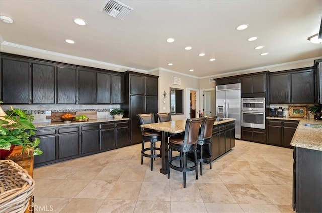 26780 Camino Seco, Temecula, CA 92590 - kitchen featuring ornamental molding, stainless steel appliances, backsplash, recessed lighting, and light stone counters
