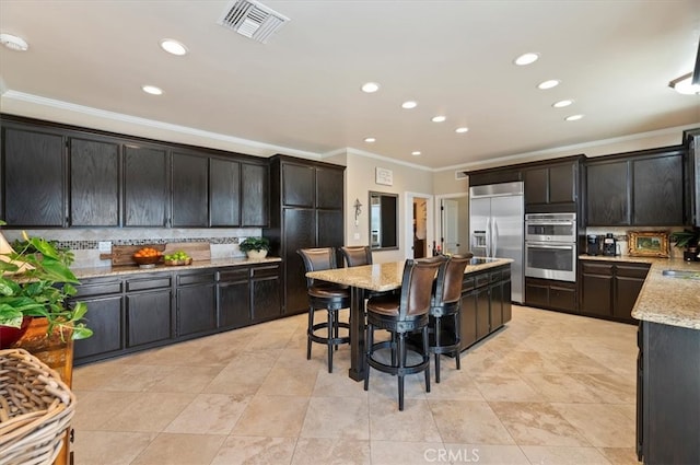 26780 Camino Seco, Temecula, CA 92590 - kitchen featuring ornamental molding, stainless steel appliances, tasteful backsplash, recessed lighting, and light stone countertops
