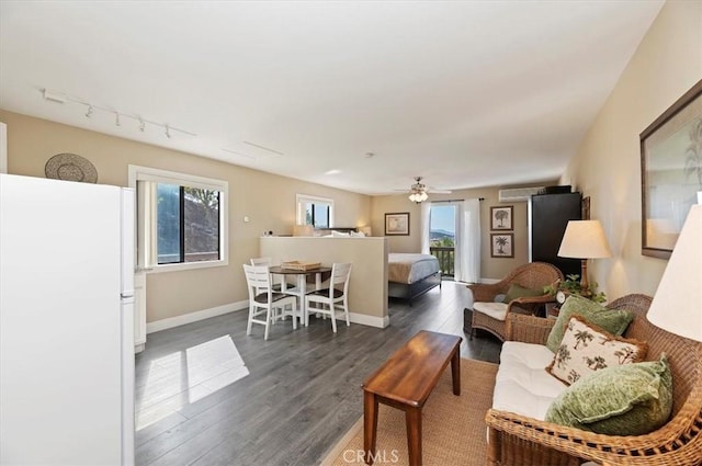 26780 Camino Seco, Temecula, CA 92590 - living area with dark wood finished floors, baseboards, ceiling fan, and track lighting