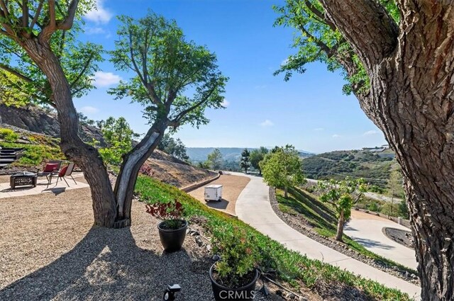 26780 Camino Seco, Temecula, CA 92590 - view of home's community with a fire pit and a mountain view