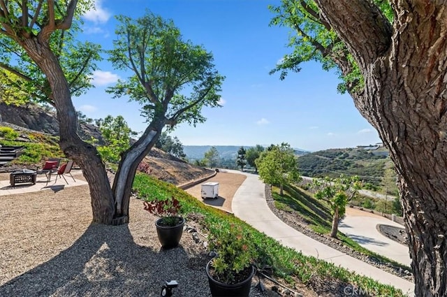 26780 Camino Seco, Temecula, CA 92590 - view of property's community with a fire pit and a mountain view