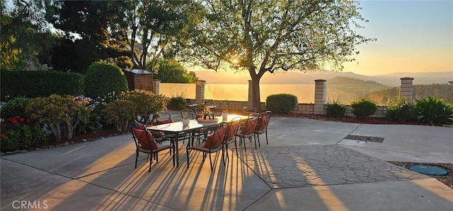 26780 Camino Seco, Temecula, CA 92590 - patio terrace at dusk with outdoor dining area, a patio, and a mountain view