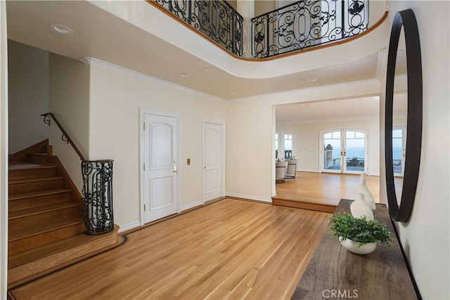 24352 Santa Clara Ave, Dana Point, CA 92629 - foyer entrance with wood finished floors, ornamental molding, stairs, and a towering ceiling