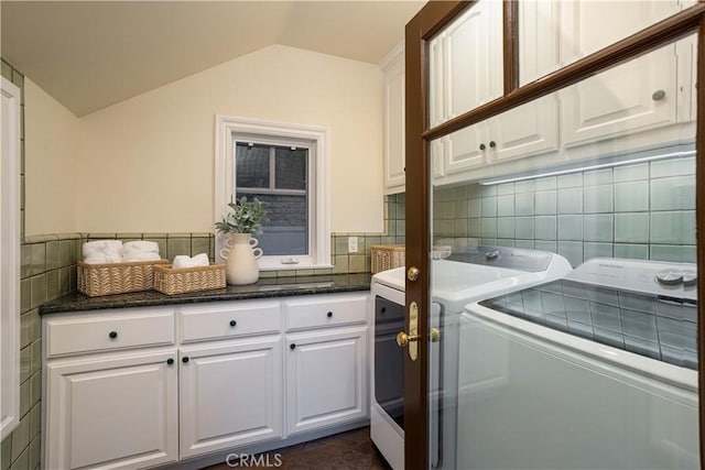 24352 Santa Clara Ave, Dana Point, CA 92629 - laundry room with cabinet space, washing machine and dryer, and tile walls