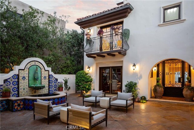 24352 Santa Clara Ave, Dana Point, CA 92629 - patio terrace at dusk featuring a balcony, a patio, french doors, and outdoor lounge area