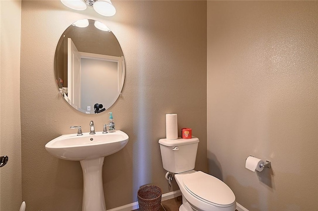 2303 Jefferson St Unit 1215, Torrance, CA 90501 - bathroom featuring toilet, baseboards, and a sink