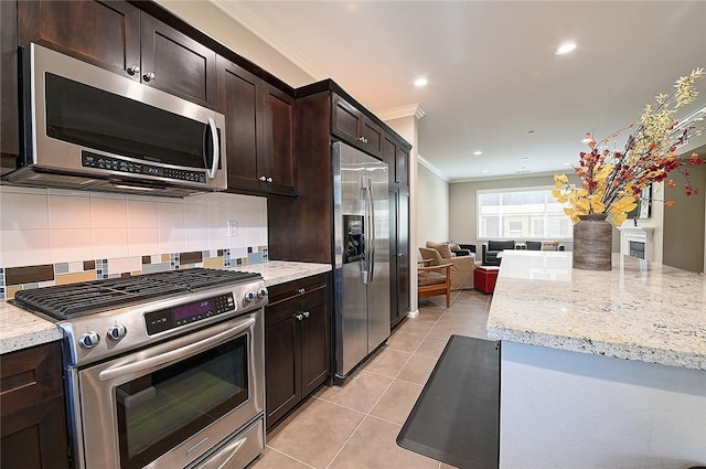 2303 Jefferson St Unit 1215, Torrance, CA 90501 - kitchen featuring appliances with stainless steel finishes, crown molding, light tile patterned floors, open floor plan, and dark brown cabinetry