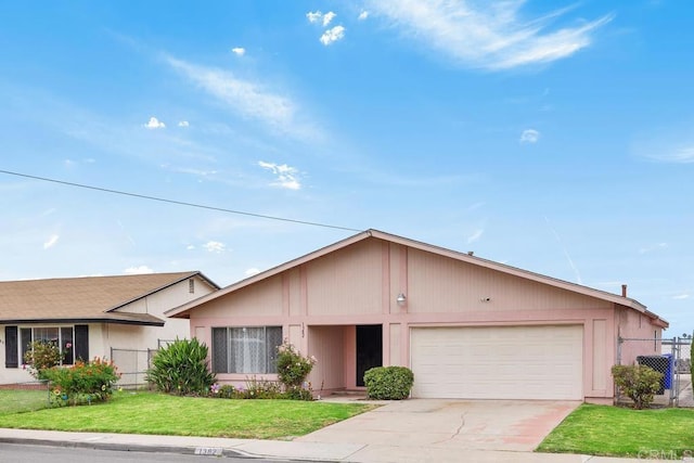 single story home with a garage and driveway