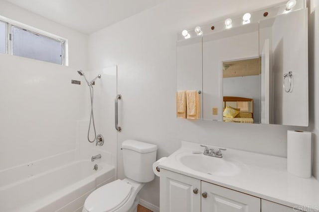 full bathroom featuring toilet, vanity, shower / bathtub combination, and baseboards