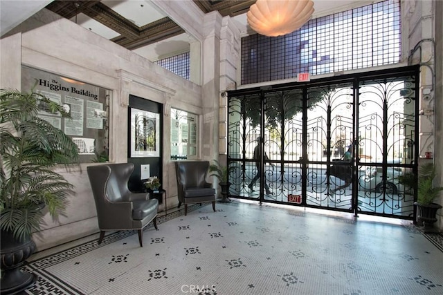 108 W 2nd St Unit 610, Los Angeles, CA 90012 - building lobby with a towering ceiling, coffered ceiling, and beam ceiling