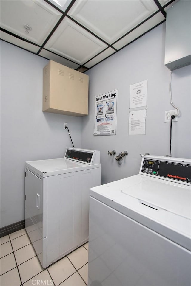 108 W 2nd St Unit 610, Los Angeles, CA 90012 - communal laundry room featuring independent washer and dryer and light tile patterned flooring
