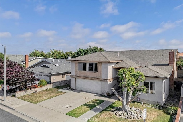 9522 Yellowstone Dr, Huntington Beach, CA 92646 - view of front of property with a shingled roof, stucco siding, concrete driveway, and a garage