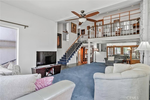9522 Yellowstone Dr, Huntington Beach, CA 92646 - living room featuring ceiling fan, stairway, and a high ceiling