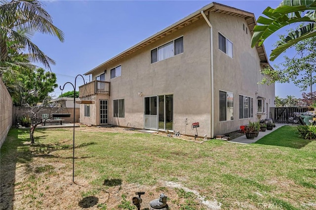 9522 Yellowstone Dr, Huntington Beach, CA 92646 - rear view of house featuring stucco siding, a balcony, a fenced backyard, and a patio