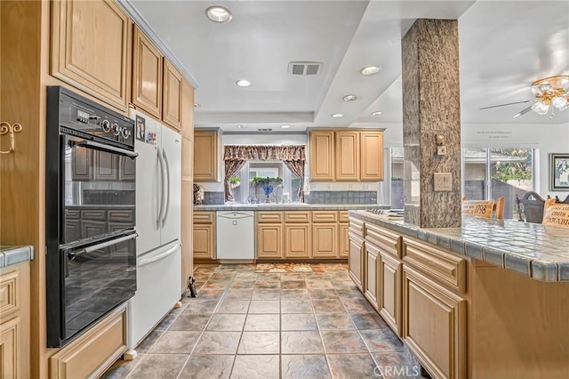 9522 Yellowstone Dr, Huntington Beach, CA 92646 - kitchen featuring white appliances, tasteful backsplash, recessed lighting, ceiling fan, and tile countertops