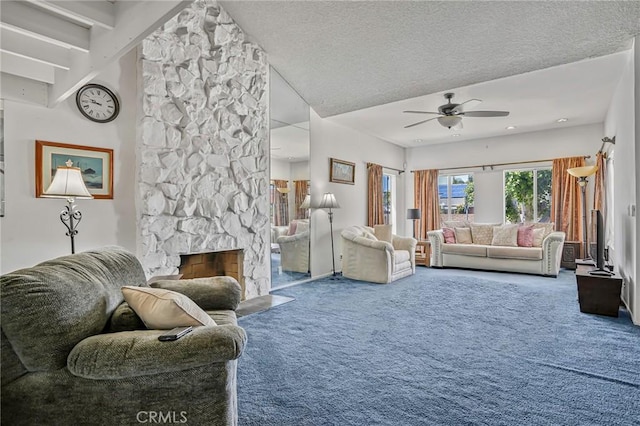 9522 Yellowstone Dr, Huntington Beach, CA 92646 - carpeted living area featuring ceiling fan, a stone fireplace, and a textured ceiling