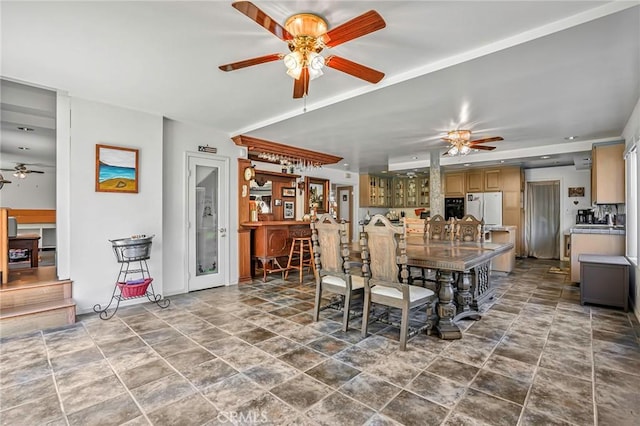 9522 Yellowstone Dr, Huntington Beach, CA 92646 - dining space featuring ceiling fan and stone finish flooring