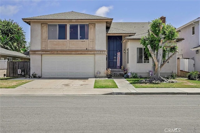 9522 Yellowstone Dr, Huntington Beach, CA 92646 - view of front of property featuring driveway, stucco siding, a garage, and a shingled roof
