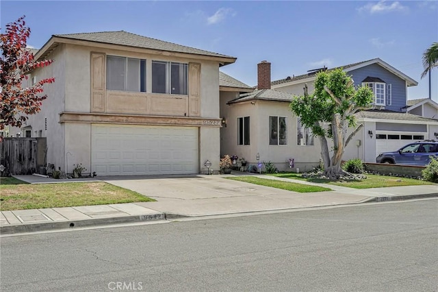 9522 Yellowstone Dr, Huntington Beach, CA 92646 - traditional-style home with concrete driveway, a garage, and stucco siding
