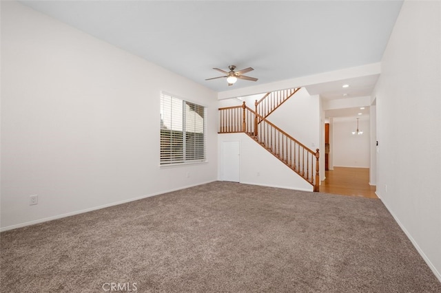 8542 E Heatherview Ln, Orange, CA 92869 - unfurnished living room with carpet flooring, a ceiling fan, stairway, baseboards, and recessed lighting