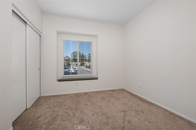 8542 E Heatherview Ln, Orange, CA 92869 - unfurnished bedroom featuring carpet flooring, a closet, and baseboards