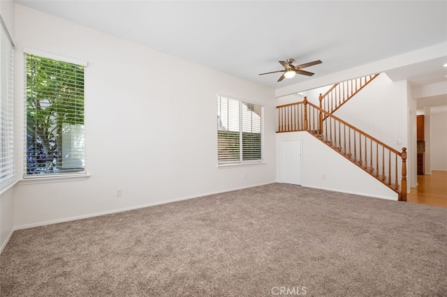 8542 E Heatherview Ln, Orange, CA 92869 - unfurnished living room with a ceiling fan, carpet floors, and stairs
