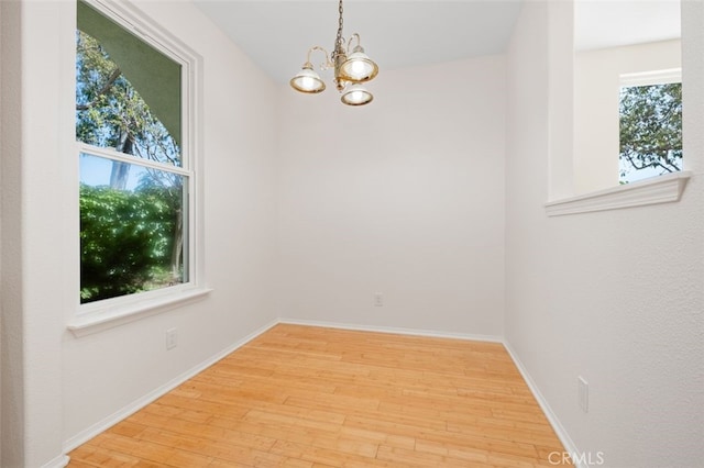 8542 E Heatherview Ln, Orange, CA 92869 - spare room with wood finished floors and a chandelier