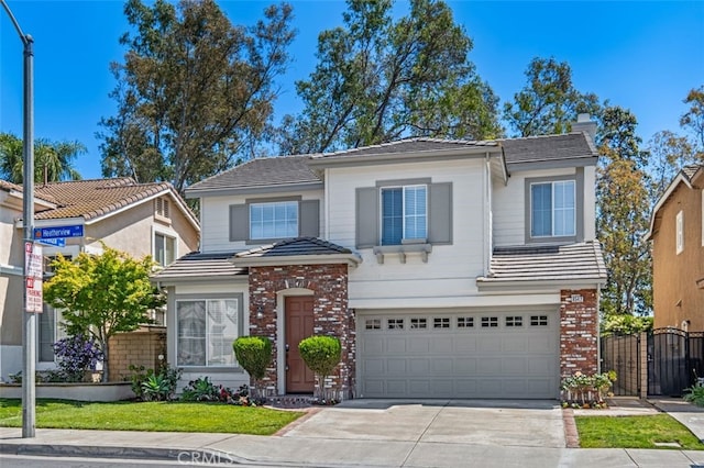 8542 E Heatherview Ln, Orange, CA 92869 - traditional home with concrete driveway, a garage, brick siding, a gate, and a tile roof
