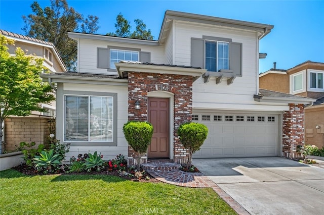 8542 E Heatherview Ln, Orange, CA 92869 - view of front facade featuring an attached garage, driveway, a front yard, and brick siding