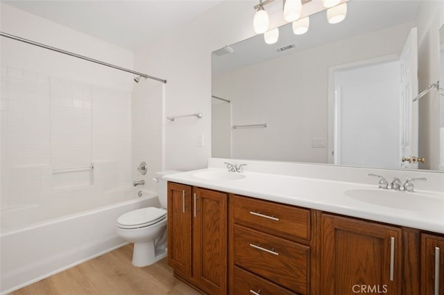 8542 E Heatherview Ln, Orange, CA 92869 - bathroom with double vanity, wood finished floors, toilet, and shower / washtub combination